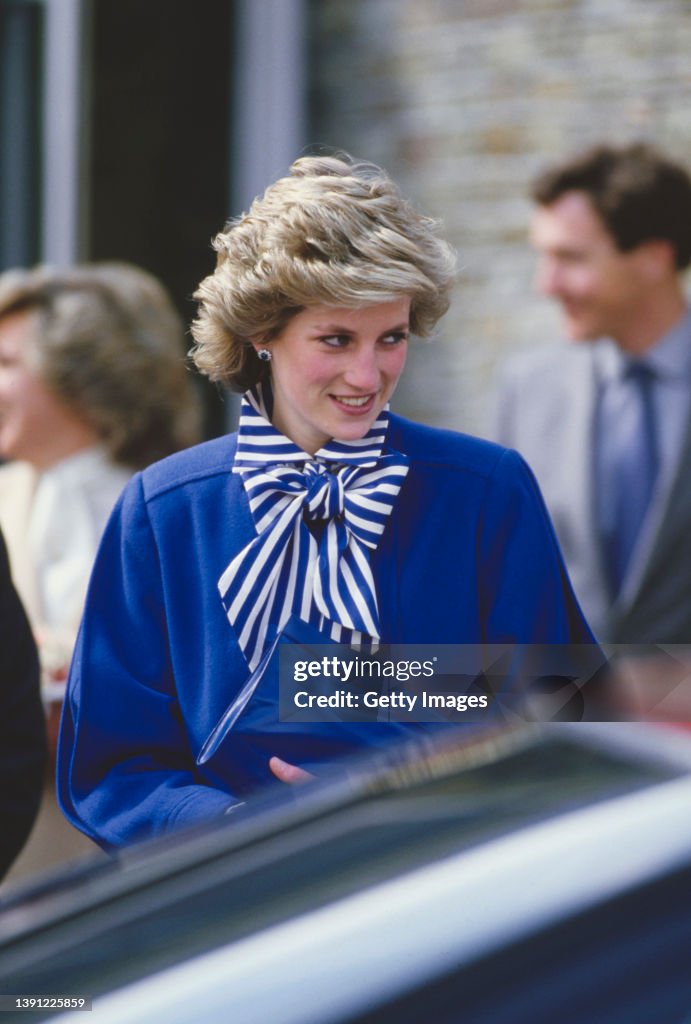 Lady Diana, Princess of Wales wearing a blue outfit, smiles on a ...