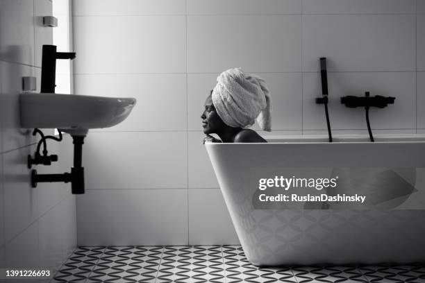beautiful african american woman bathing in a tub. - escape the room event stock pictures, royalty-free photos & images