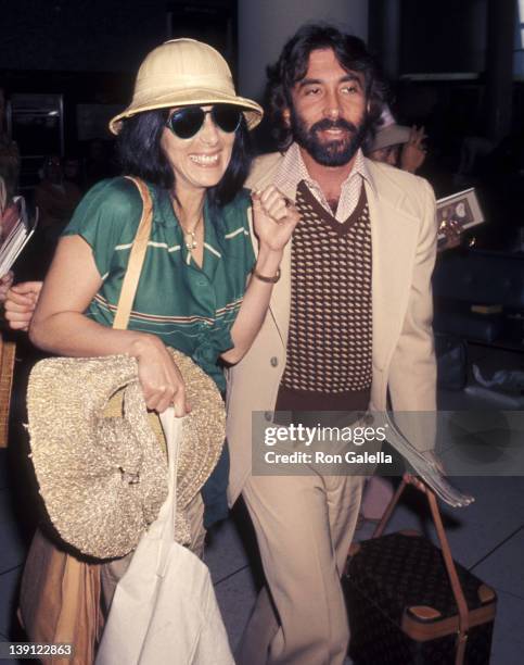 Singer Cher and celebrity manager Sandy Gallin on March 13, 1977 arrive at the Los Angeles International Airport in Los Angeles, California.