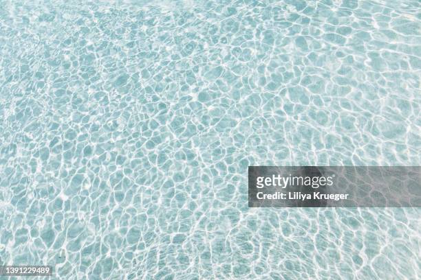 abstract background with water ripple in swimming pool. - water ripple stock-fotos und bilder