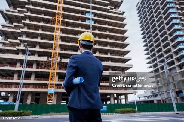 the engineer inspects the site - person in suit construction stock pictures, royalty-free photos & images