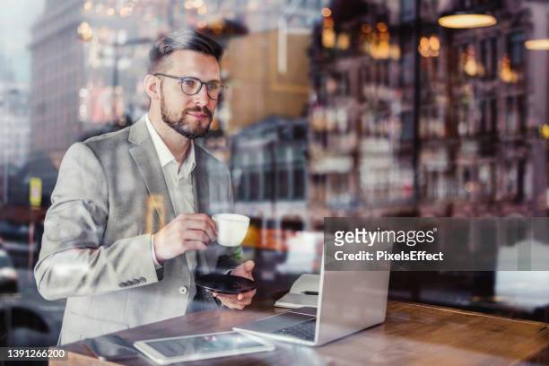 his favorite place for coffee - enjoying coffee cafe morning light stock pictures, royalty-free photos & images