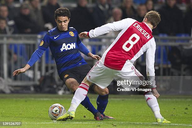 Fabio da Silva of Manchester United,Christian Eriksen of Ajax during the UEFA Europa League round of 32 match between AFC Ajax and Manchester United...