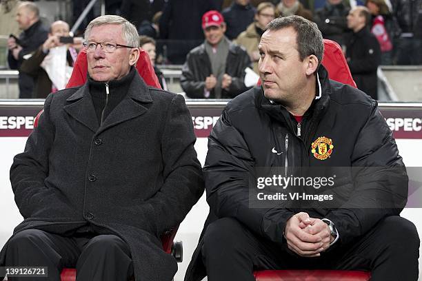 Sir Alex Ferguson of Manchester United,Rene Meulensteen of Manchester United during the UEFA Europa League round of 32 match between AFC Ajax and...