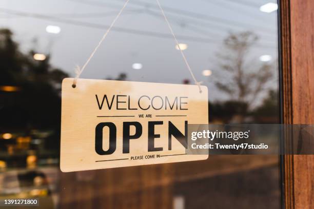 welcome we're open - store sign stock-fotos und bilder