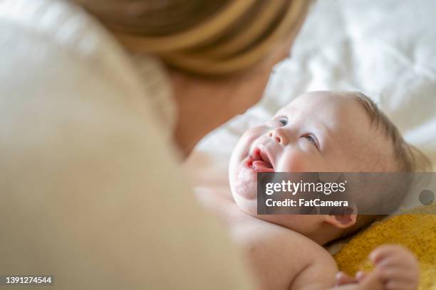 face-to-face with mommy - down syndrome baby stock pictures, royalty-free photos & images