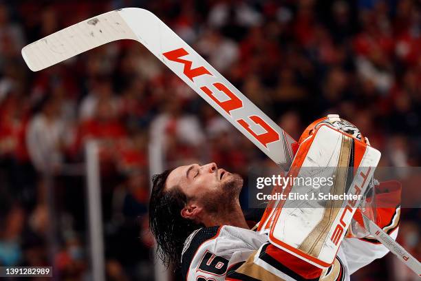 Goaltender John Gibson of the Anaheim Ducks gets his gear together after a break in the action against the Florida Panthers at the FLA Live Arena on...