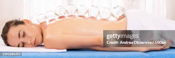 vaccum cupping therapy banner,midsection of woman having spa treatment,slovakia - vacuum packed stock pictures, royalty-free photos & images