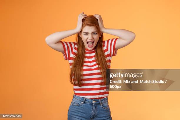 uneasy depressed fed up pissed redhead girlfriend,scream upset,grab - wow stock-fotos und bilder