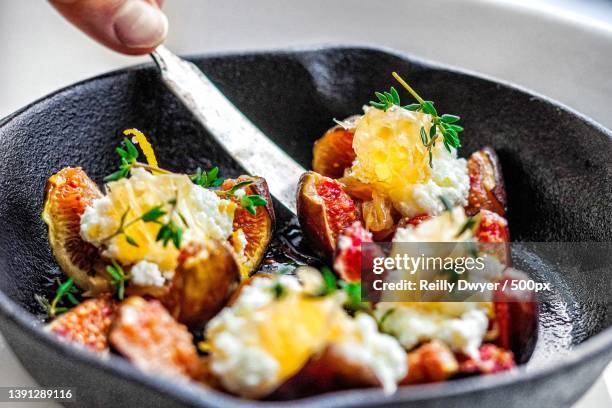 close-up view of cropped hand of person preparing food to eat - part of human organic stock pictures, royalty-free photos & images