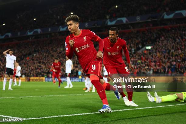 Roberto Firmino of Liverpool celebrates after scoring their team's third goal with Joel Matip during the UEFA Champions League Quarter Final Leg Two...