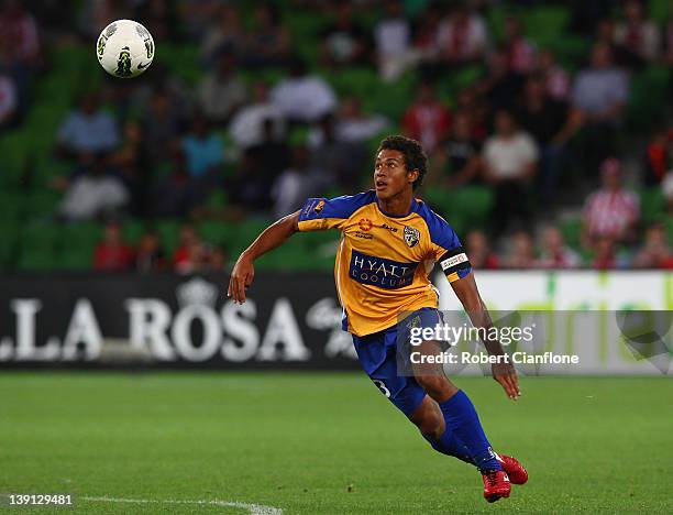Mitch Cooper captain of Gold Coast United chases the ball during the round 20 A-League match between the Melbourne Heart and Gold Coast United at...