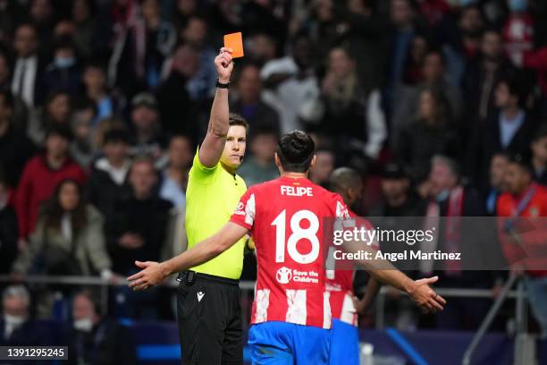 Referee Daniel Siebert gives Felipe of Atletico Madrid a red card during the UEFA Champions League Quarter Final Leg Two match between Atletico...