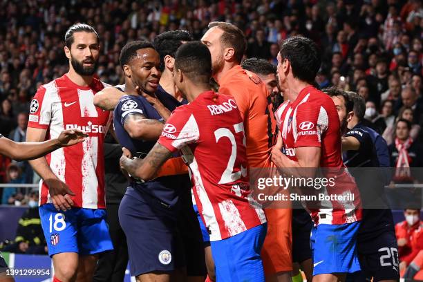 Raheem Sterling of Manchester City clashes with Reinildo Mandava of Atletico Madrid during the UEFA Champions League Quarter Final Leg Two match...