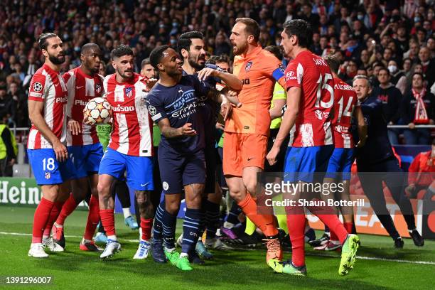 İlkay Gundogan and Raheem Sterling of Manchester City clash with Jan Oblak and Stefan Savic of Atletico Madrid during the UEFA Champions League...
