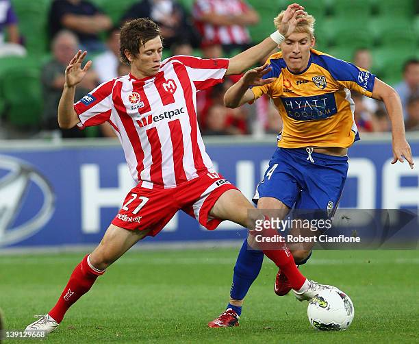 Craig Goodwin of the Heart is challenged by Ben Halloran of Gold Coast United during the round 20 A-League match between the Melbourne Heart and Gold...