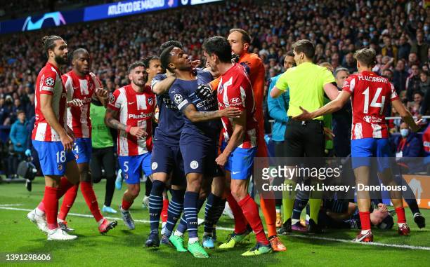 Raheem Sterling of Manchester City clashes with Stefan Savic of Atletico Madrid during the UEFA Champions League Quarter Final Leg Two match between...