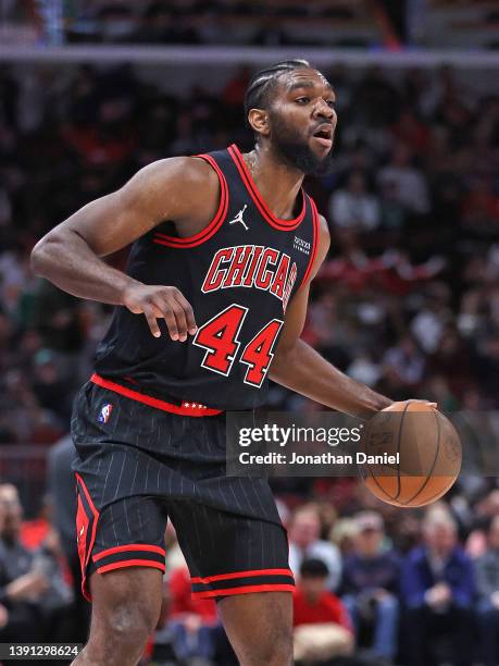 Patrick Williams of the Chicago Bulls advances the ball as he looks to pass against the Boston Celtics at the United Center on April 06, 2022 in...