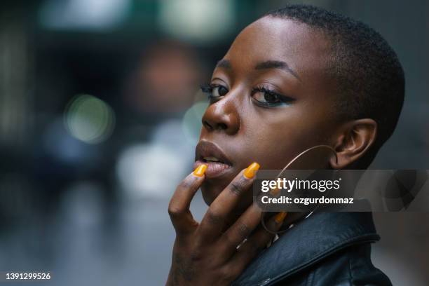 young beautiful african american female portrait on the street - african american nails stock pictures, royalty-free photos & images