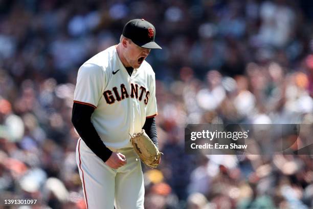 Logan Webb of the San Francisco Giants reacts after he struck out Trent Grisham of the San Diego Padres to end the eighth inning at Oracle Park on...