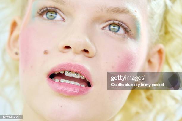 a close-up of a young woman with braces on her teeth - makeup before and after bildbanksfoton och bilder