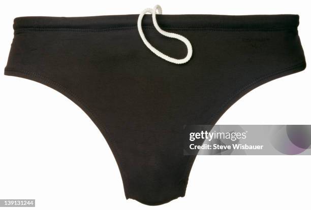 a pair of mens black racing briefs for swimming - speedo stockfoto's en -beelden