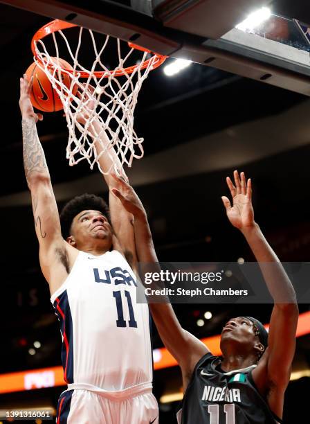 Kel'el Ware of USA Team attempts to dunk against Vincent Iwuchukwu of World Team in the first quarter during the Nike Hoop Summit at Moda Center on...