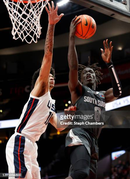Omaha Biliew of World Team shoots against Kel'el Ware of USA Team in the third quarter during the Nike Hoop Summit at Moda Center on April 08, 2022...