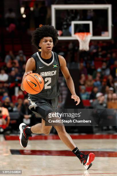 London Johnson of World Team dribbles against USA Team in the third quarter during the Nike Hoop Summit at Moda Center on April 08, 2022 in Portland,...