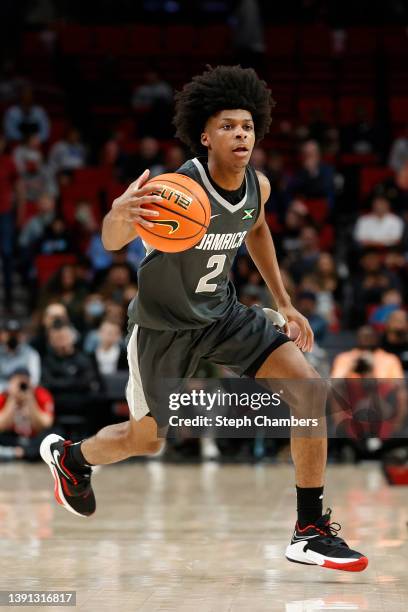 London Johnson of World Team dribbles against USA Team in the third quarter during the Nike Hoop Summit at Moda Center on April 08, 2022 in Portland,...