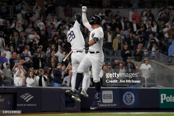 Aaron Judge of the New York Yankees celebrates his fifth inning home run against the Toronto Blue Jays with teammate Josh Donaldson at Yankee Stadium...