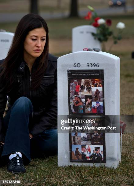 Melinda Dickmyer spends Valentines Day with her deceased husband U.S. Army Staff Sargent Adam Dickmyer at Arlington National Cemetery on February 14,...