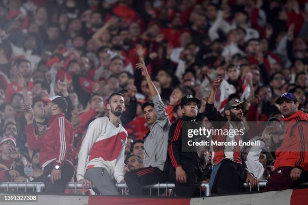 Fans of River Plate cheer during the Copa CONMEBOL Libertadores 2022 match between River Plate and Fortaleza at Estadio Monumental Antonio Vespucio...