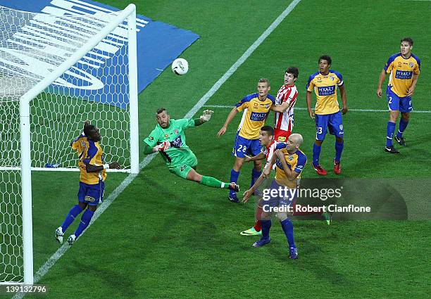 Adama Traore of Gold Coast United clears a shot from Simon Colosimo of the Heart during the round 20 A-League match between the Melbourne Heart and...