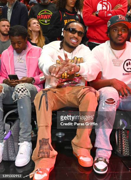 Rapper Quavo attends the game between the Charlotte Hornets and the Atlanta Hawks during the 2022 Play-In Tournament on April 13, 2022 at State Farm...