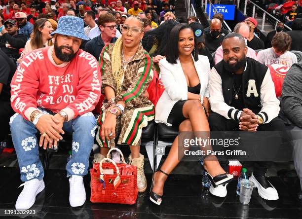 Kenny Burns, Kimberly Blackwell, Kandi Burruss, and Todd Tucker attend the game between the Charlotte Hornets and the Atlanta Hawks during the 2022...