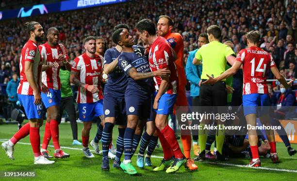 Raheem Sterling of Manchester City clashes with Stefan Savic of Atletico Madrid during the UEFA Champions League Quarter Final Leg Two match between...