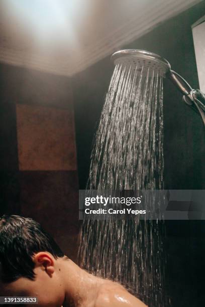 teen boy enjoying shower - boys taking a shower stock pictures, royalty-free photos & images