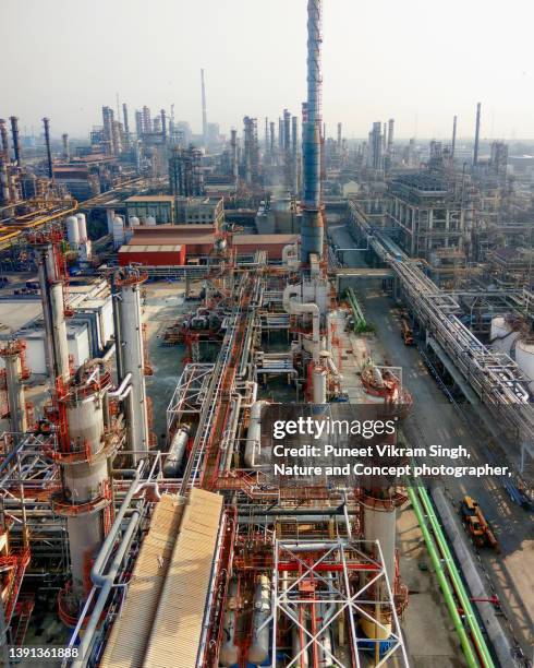 a crude oil refinery complex in india with interconnected piping, columns, vessels, heat exchangers etc. - refinery stock pictures, royalty-free photos & images