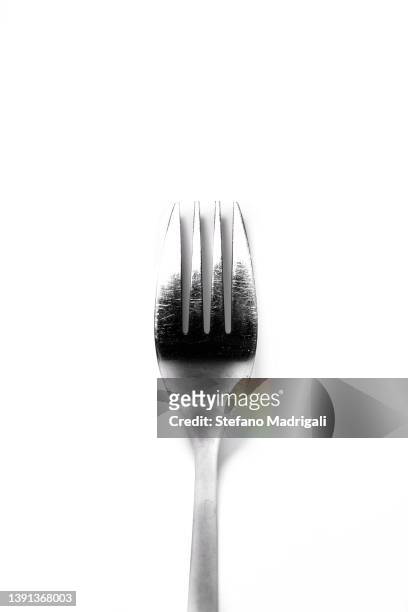 silver fork on white background - salad server stock pictures, royalty-free photos & images