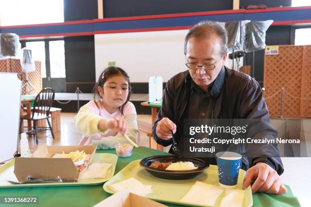 father and child eating lunch together during travel - filipino family eating stock pictures, royalty-free photos & images