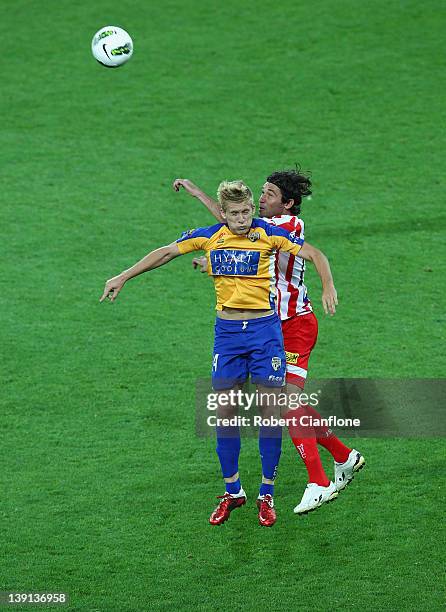 Ben Halloran of Gold Coast United is challenged by Wayne Srhoj of the Heart during the round 20 A-League match between the Melbourne Heart and Gold...