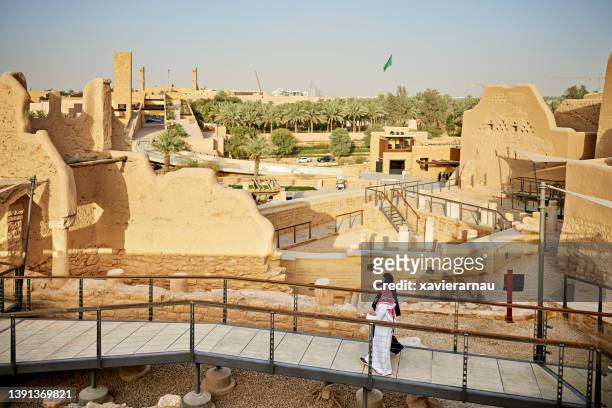 locals visiting at-turaif ruins, site of first saudi capital - saudi arabia national day stock pictures, royalty-free photos & images