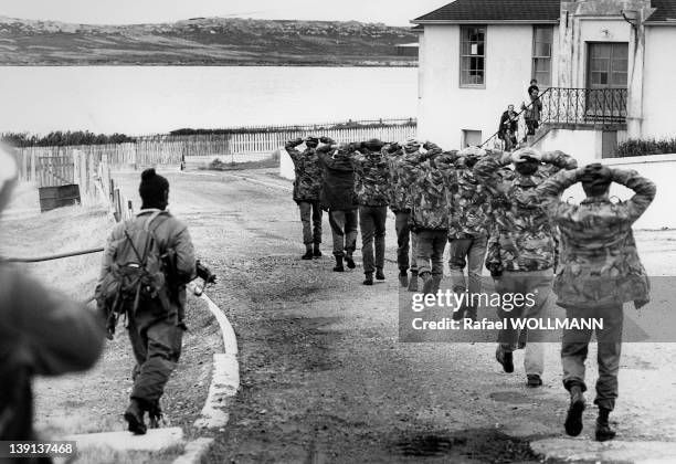 British soldiers surrender to Argentine troops who invaded the islands on April 2, 1982 in Port Stanley, Falkland Islands.