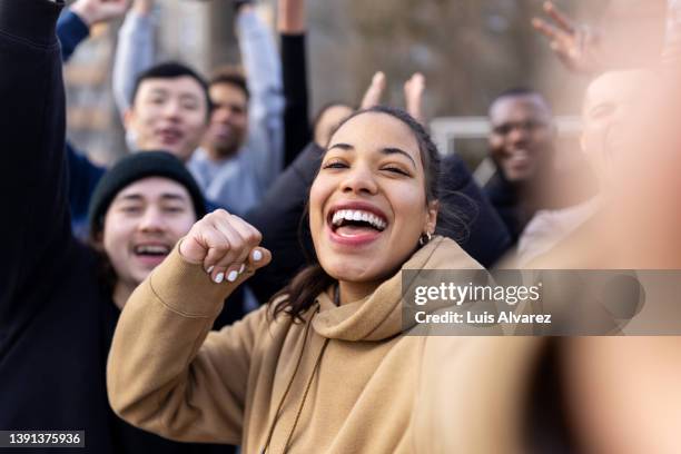 cheerful soccer players having fun taking a selfie outdoors - selfie young people photos et images de collection