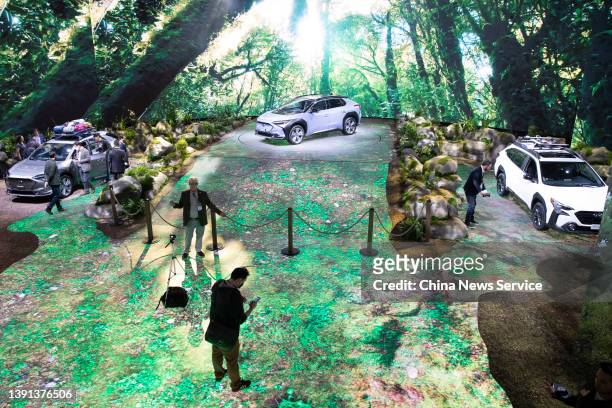 People visit the Subaru stand during the press preview for the International Auto Show at the Jacob Javits Convention Center on April 13, 2022 in New...