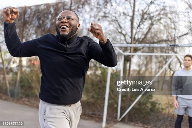 african man celebrating after scoring a goal - game 27 23 stock pictures, royalty-free photos & images