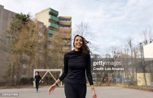 young hispanic woman on soccer court in the city - amateur photography stock pictures, royalty-free photos & images