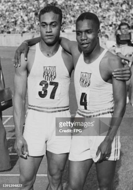 American 4x100 metres relay teammates American athlete Mozelle Ellerbe with his arm round the shoulder of his teammate, American athlete Ben Johnson...