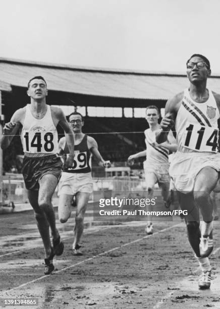 American athlete Reggie Pearman winning the 880 yards event from Canadian athlete Jack Hutchins and British athlete Tom White and American athlete...